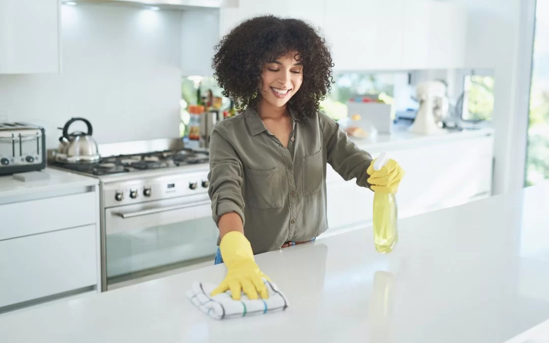 Woman cleaning a beautiful sparkling clean kitchen